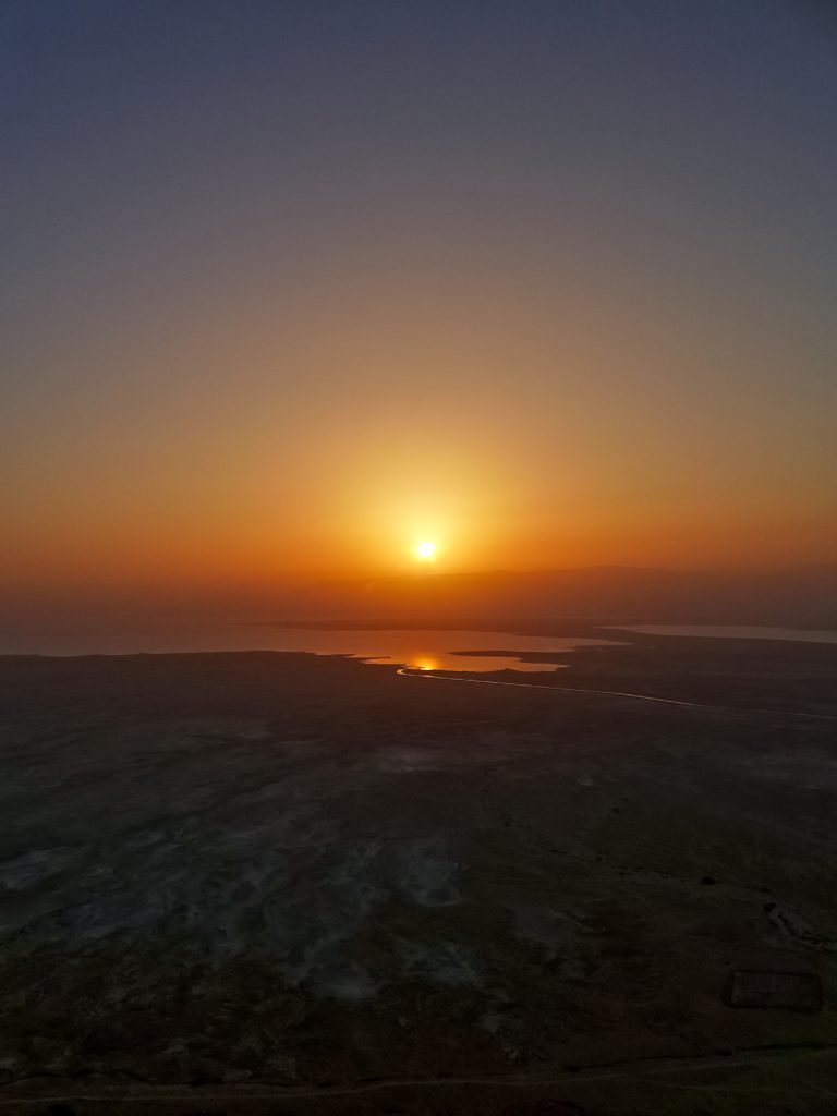 Why hiking Masada at sunrise is a must if you're in Israel...climb the Snake Path for breathtaking views of the Dead Sea. Tips for finding a tour, what to wear and bring, how to make the most of this experience.
