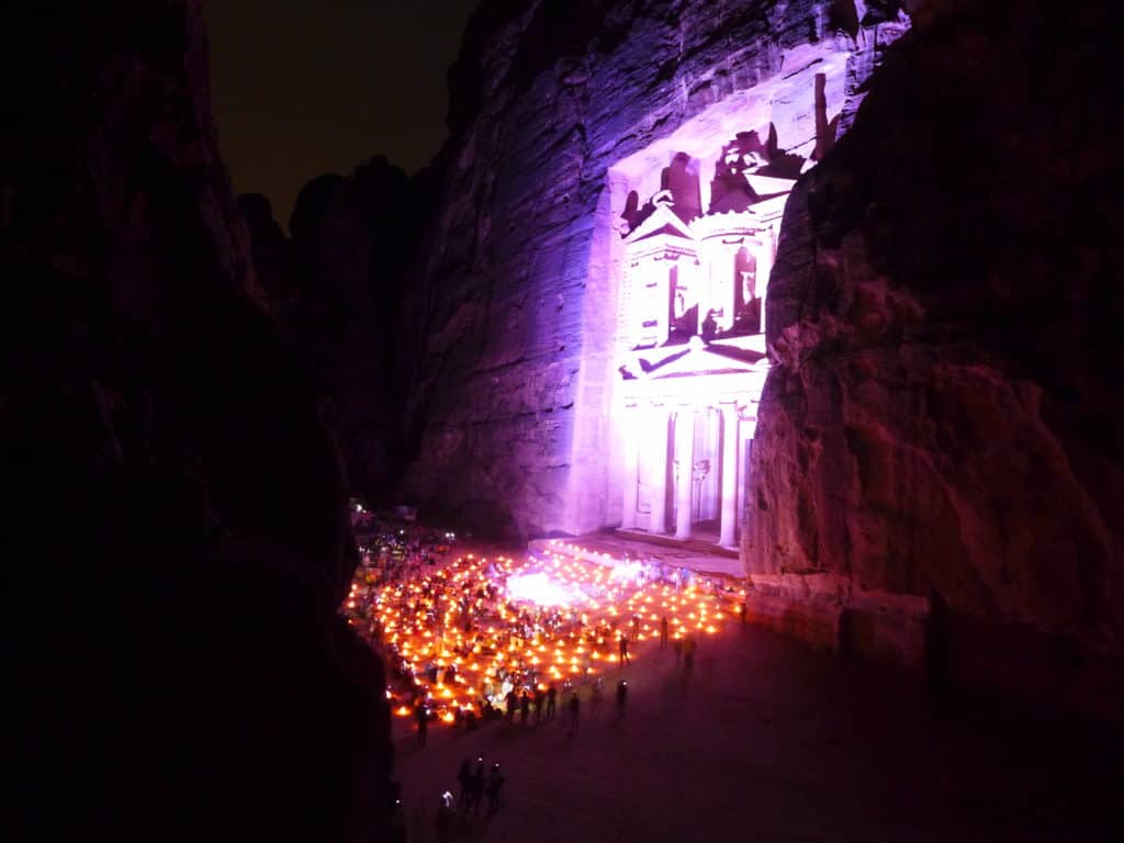 A secret viewing point for Petra by Night. This is a can't-miss experience when visiting Jordan | Tips for seeing Petra at Night, one of the Seven Wonders of the World | Lost City of Petra at night, Wadi Musa, Jordan