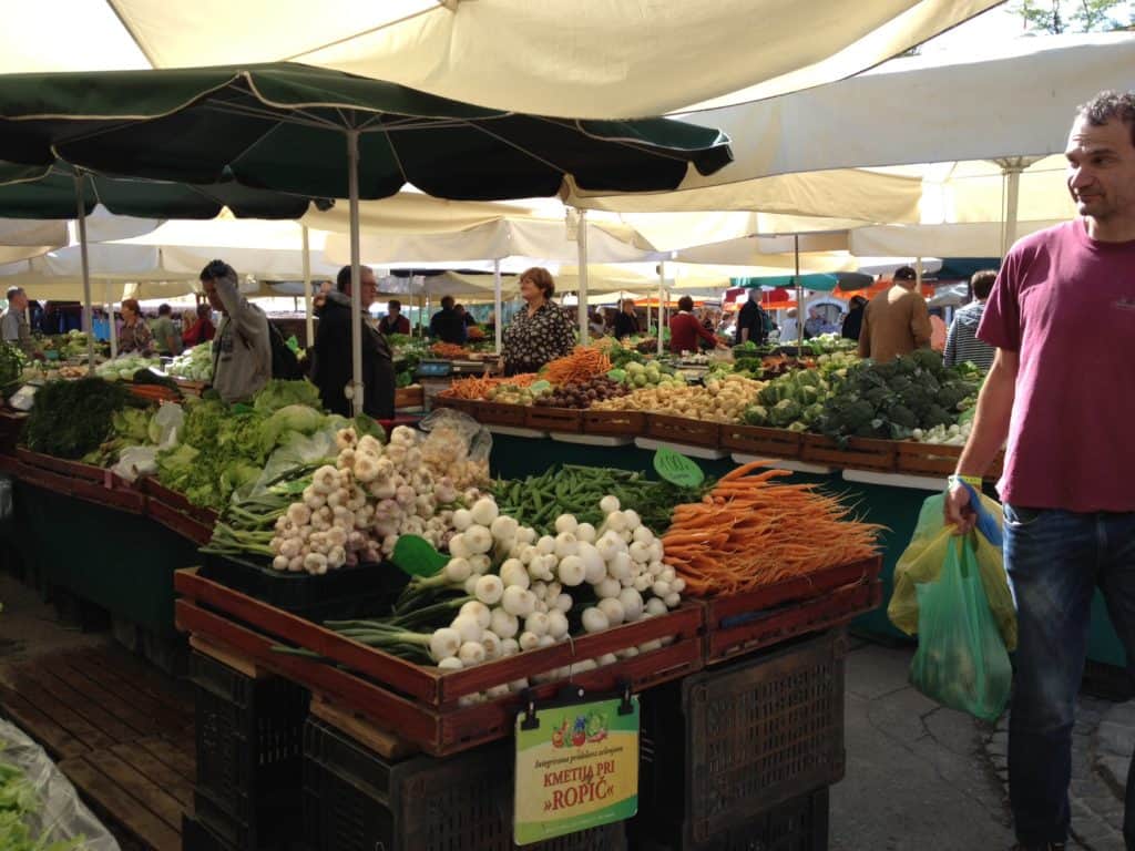 Central Market in Ljubljana, Slovenia is one of the biggest farmers markets I've ever seen! It's a great way to explore this gorgeous, vibrant city. What to do in Ljubljana, tips for your trip to Slovenia!