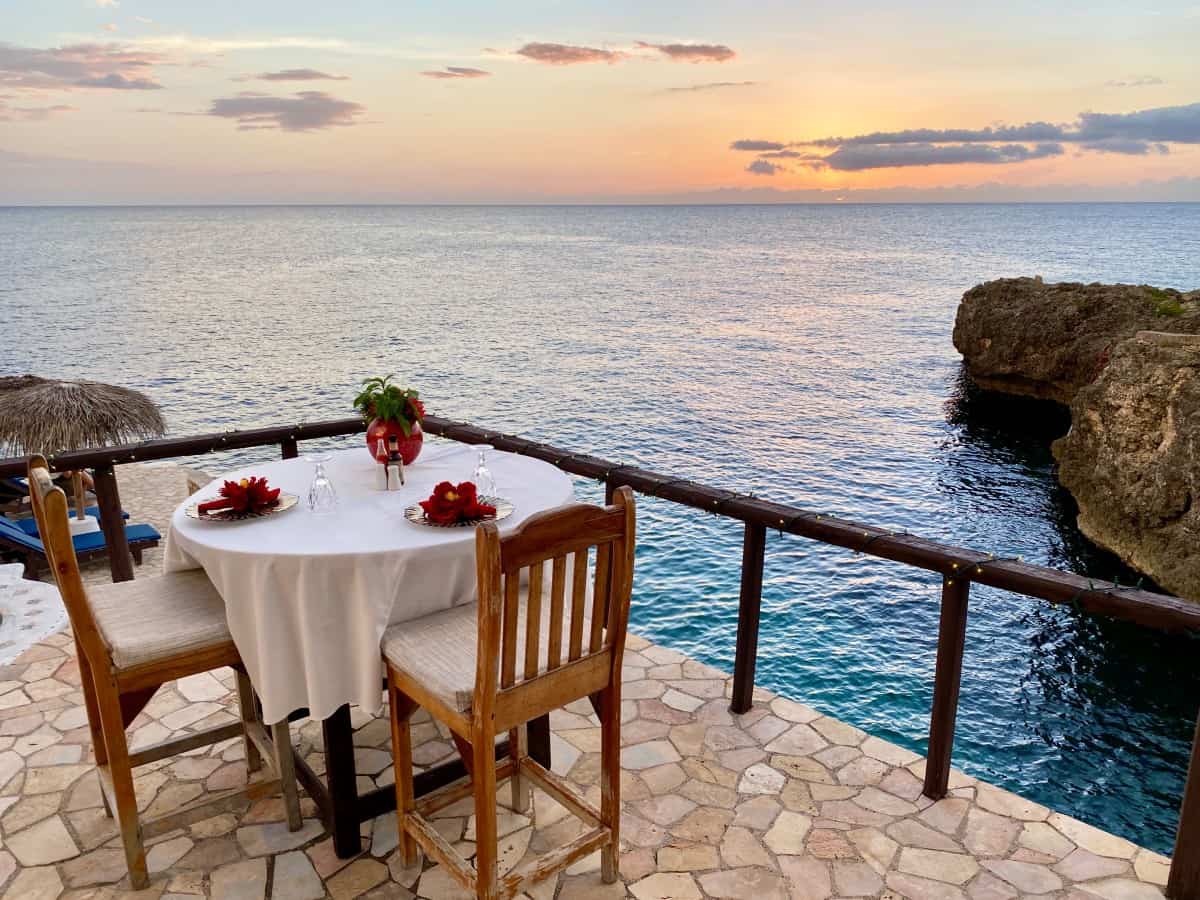 Ivan's Restaurant at Catcha Falling Star: Maybe the Best Sunset Dinner in Negril | If you're visiting Negril, Jamaica, you have to plan a special dinner at Ivan's...probably the best sunset view from the cliffs, Ivan's Catcha Falling Star restaurant has delicious food, great drinks, amazing ocean sunset views, & more. A detailed review of Ivans Negril. #sunset #negril #jamaica #bestrestaurant