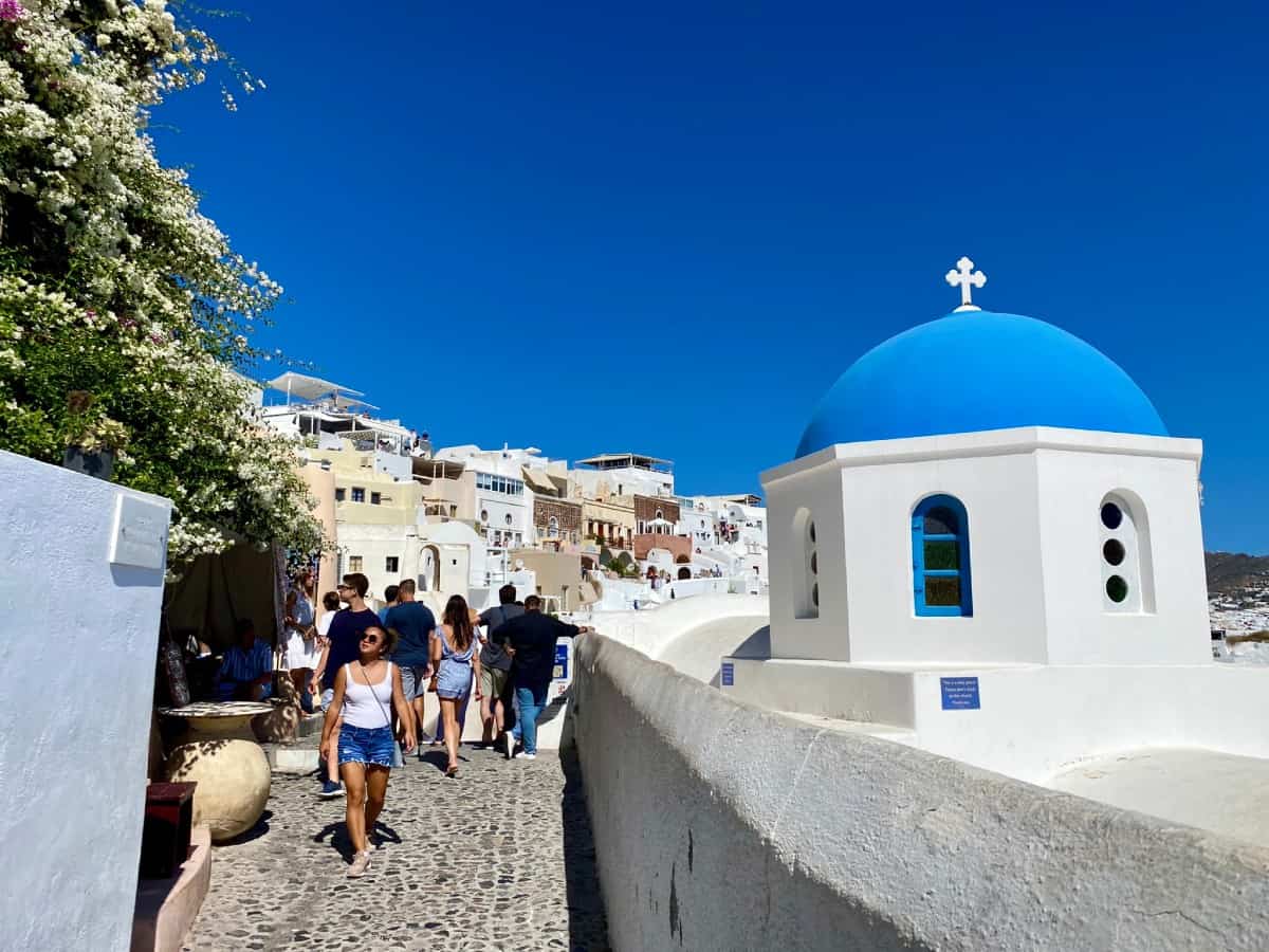 Things to do in Oia, Santorini (& is Oia worth visiting?) - one view of the famous blue domes (Agios Nikolaos)