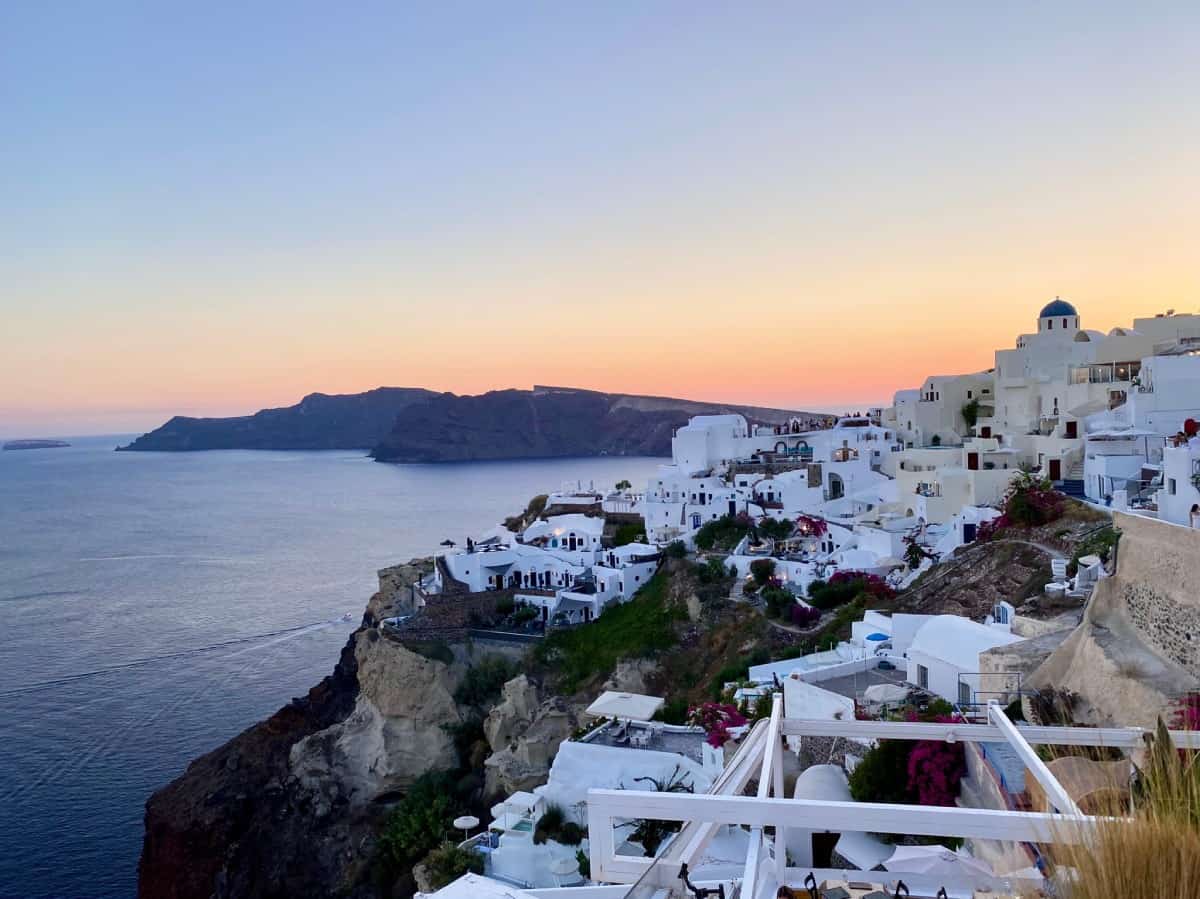 Things to do in Oia, Santorini - sunset from the patio at Thalami restaurant