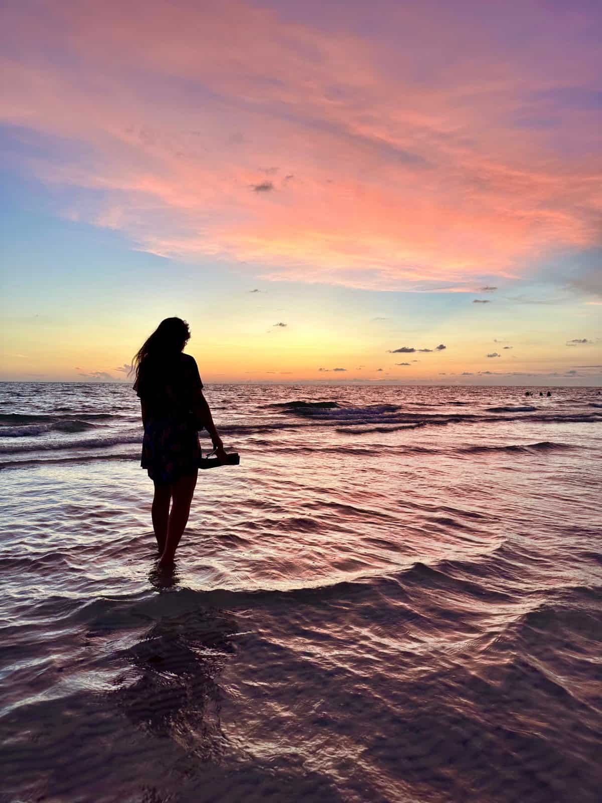 woman silhouette at sunset beach at Marco Island, FL - JW Marriott Marco Island beach 